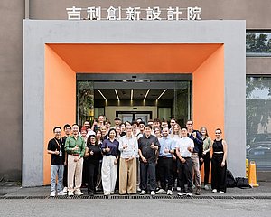 Group photo of the excursion in front of the Geely Design Center in Shanghai.