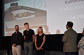 Kevin Kuchnia, Simon Olescher und Katharina Rott bei der Preisverleihung im Ramen der IAA Mobility 2025 in München.