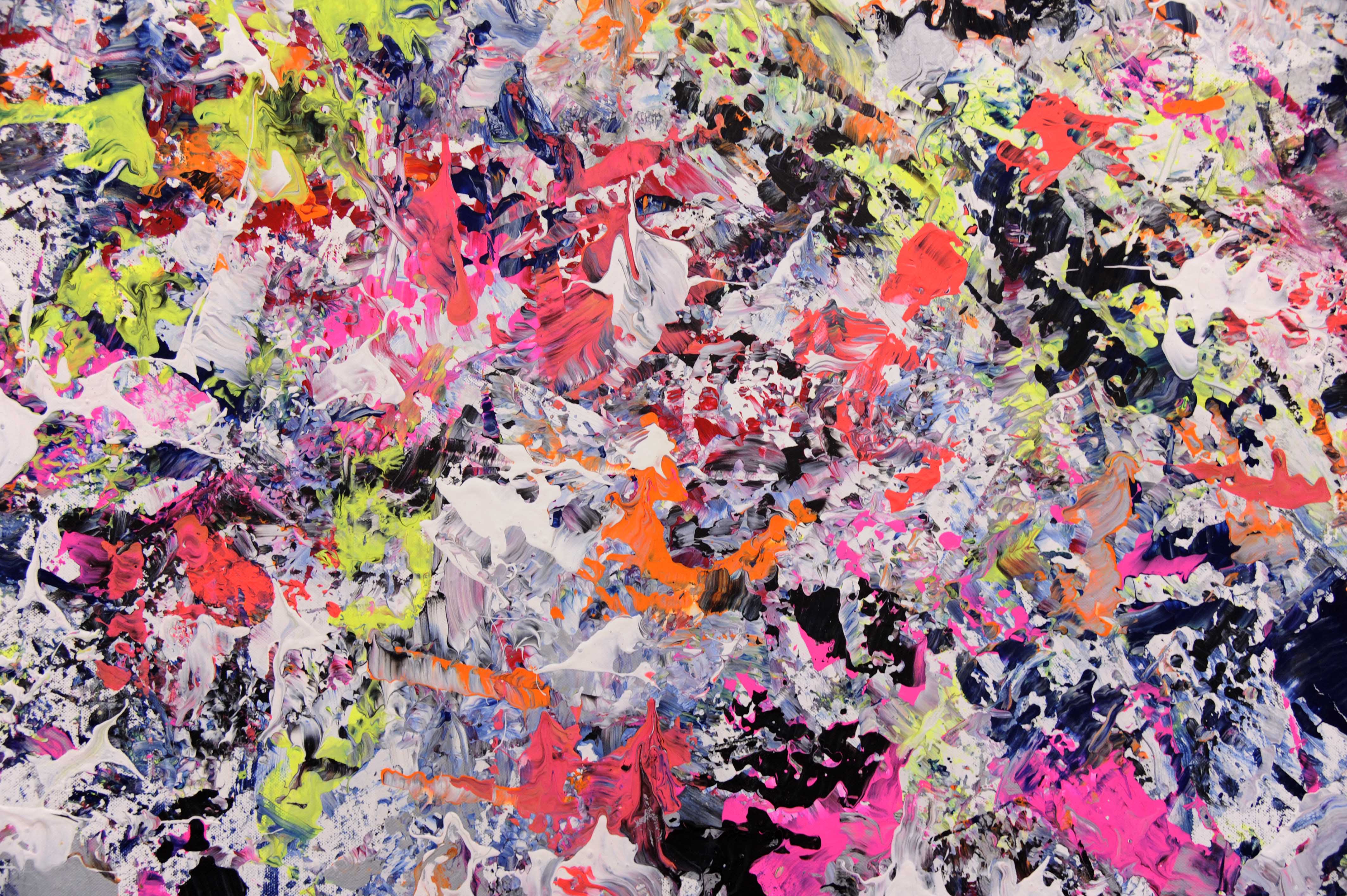 Picture of colorful splashes of paint on a canvas